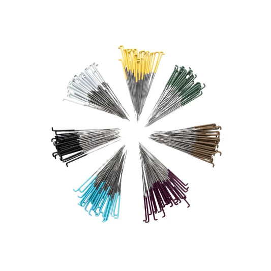 Different painted needle sets arranged in a  circle