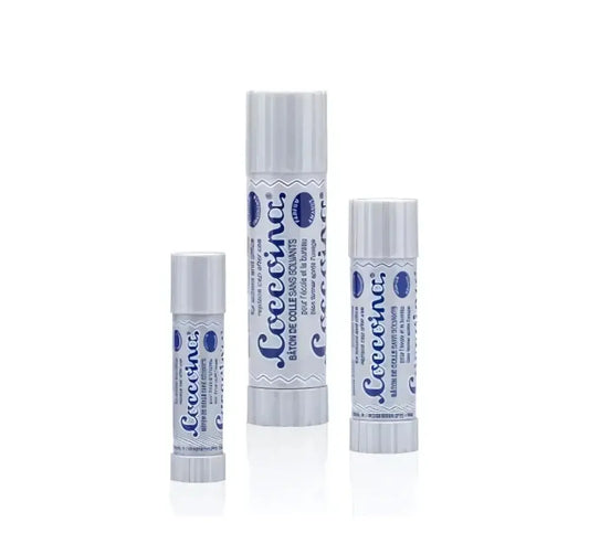Three sizes of Coccoina glue sticks in gray containers on a white background