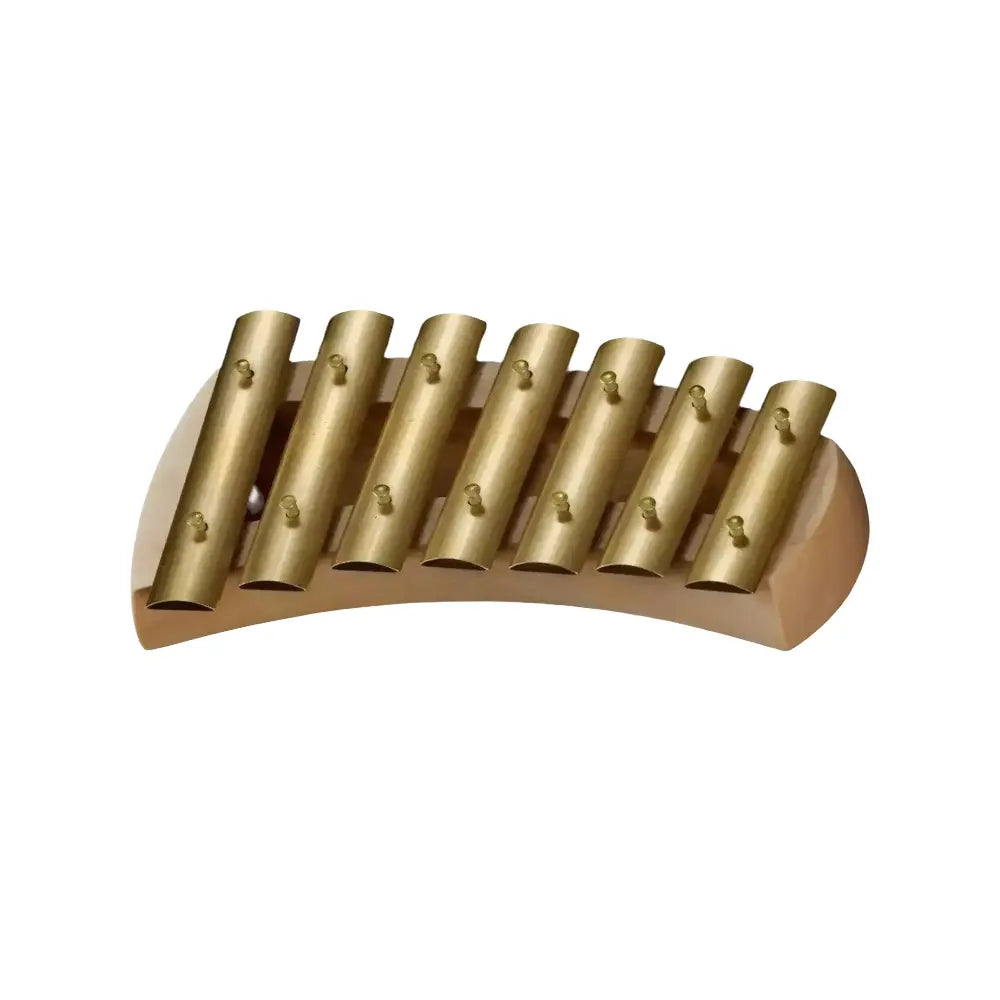 Wooden musical glockenspiel instrument with brass keys on a white background
