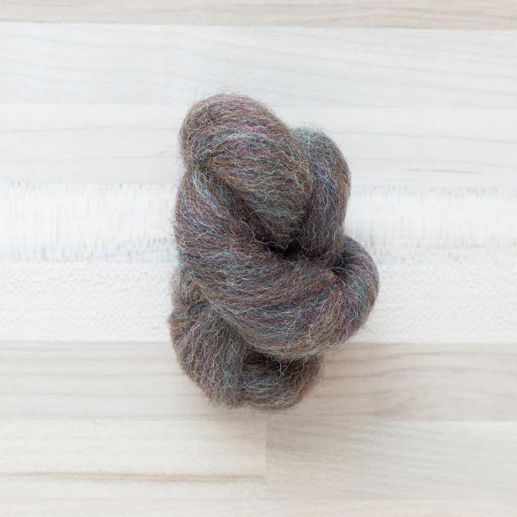 Pine Cone Wool Roving Felter's Flowing on tabletop