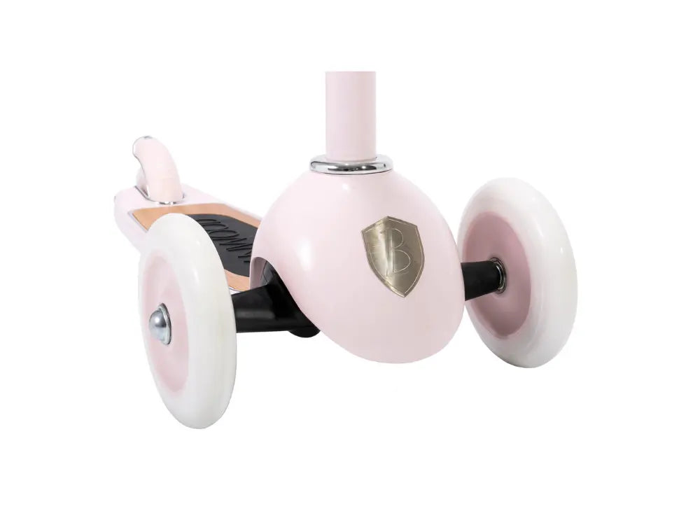 Pink scooter with white wheels on a white background