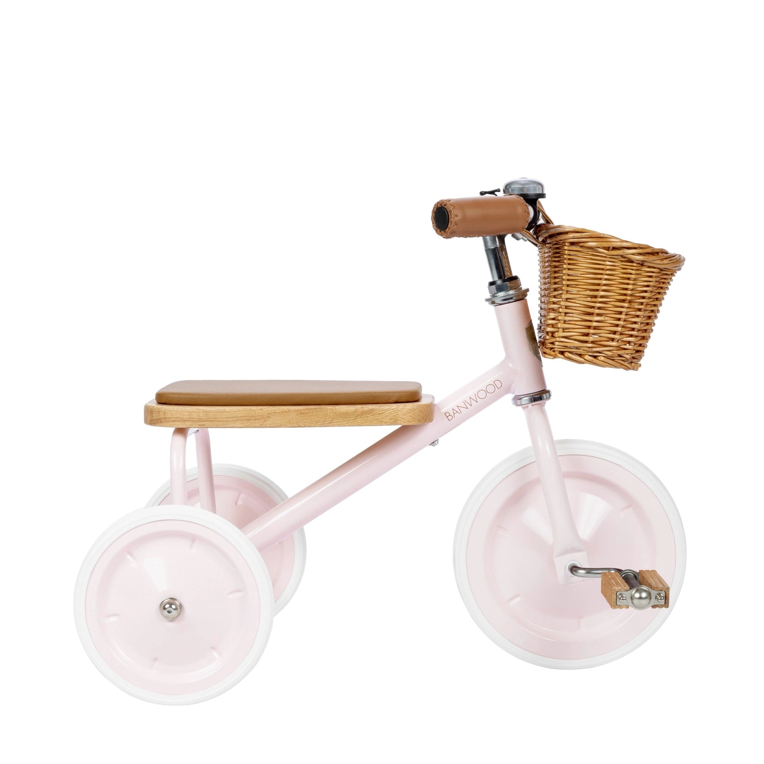 Pink children's tricycle with a wicker basket on a white background