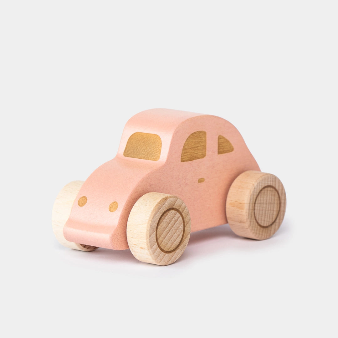 Pink wooden beetle toy car angle view for preschool play 