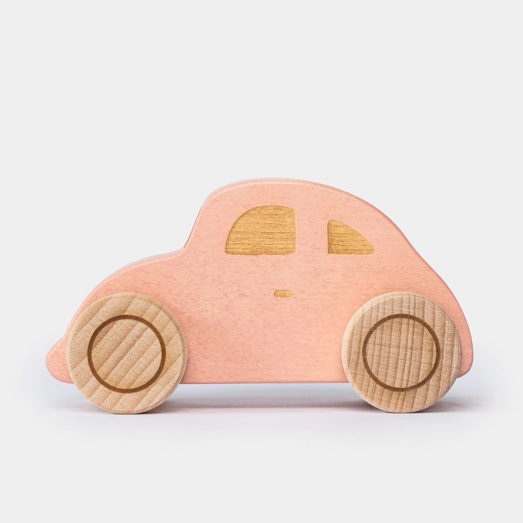 Pink wooden beetle toy car side view for preschool play 