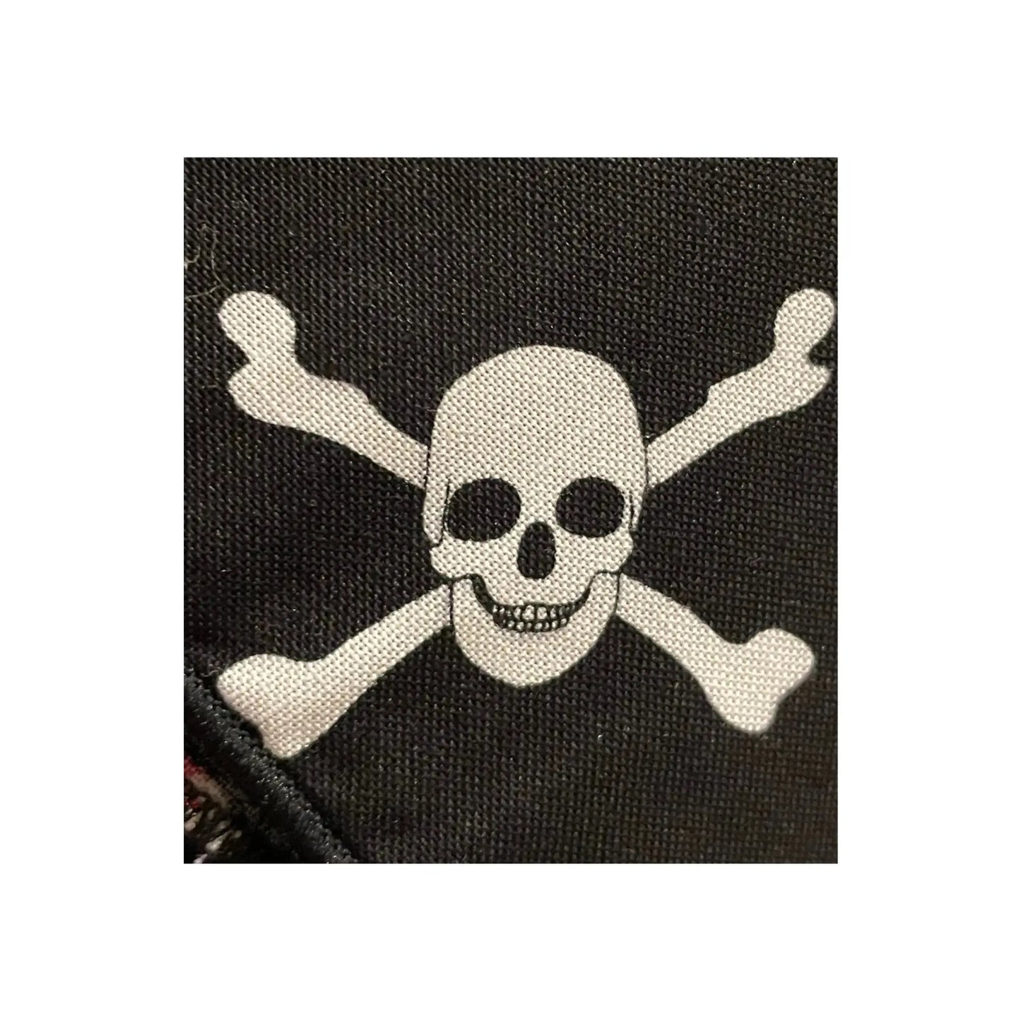 Close-up of skull and crossbones pattern variation on cotton pirate bandana
