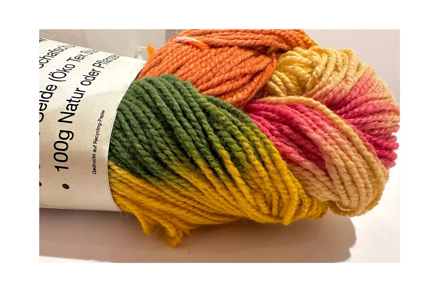 Organic Wool & Silk Plant Dyed Rainbow Yarn close up on a light background