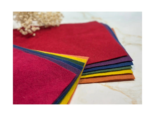 Plant-dyed wool felt sheets by Filges stacked to show layered colors and thickness