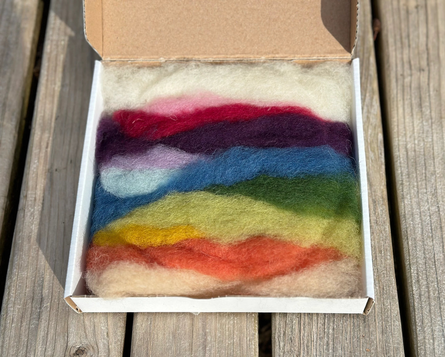 Filges wool fairy craft kit with plant dyed wool roving on a wooden surface