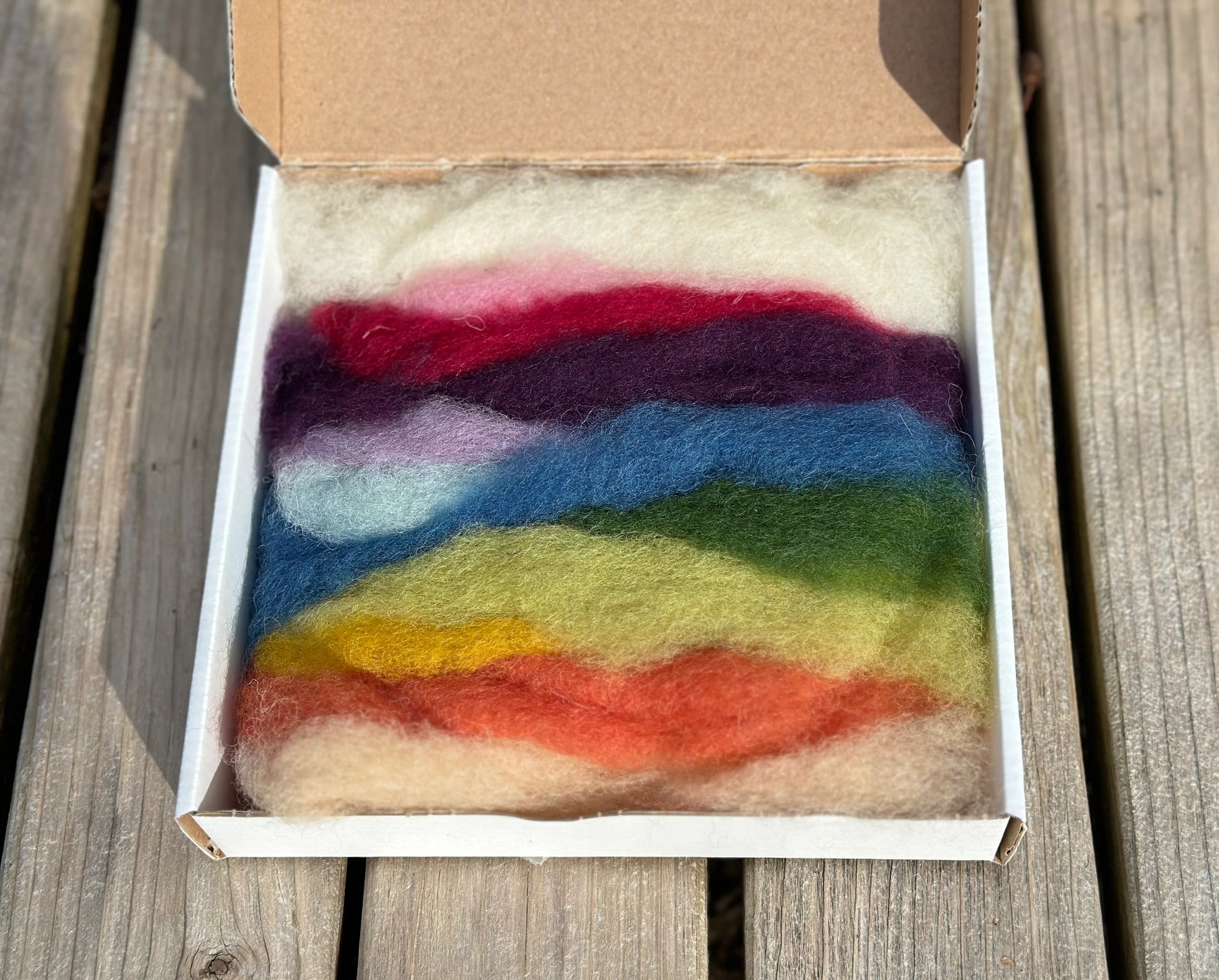 Filges wool fairy craft kit with plant dyed wool roving on a wooden surface