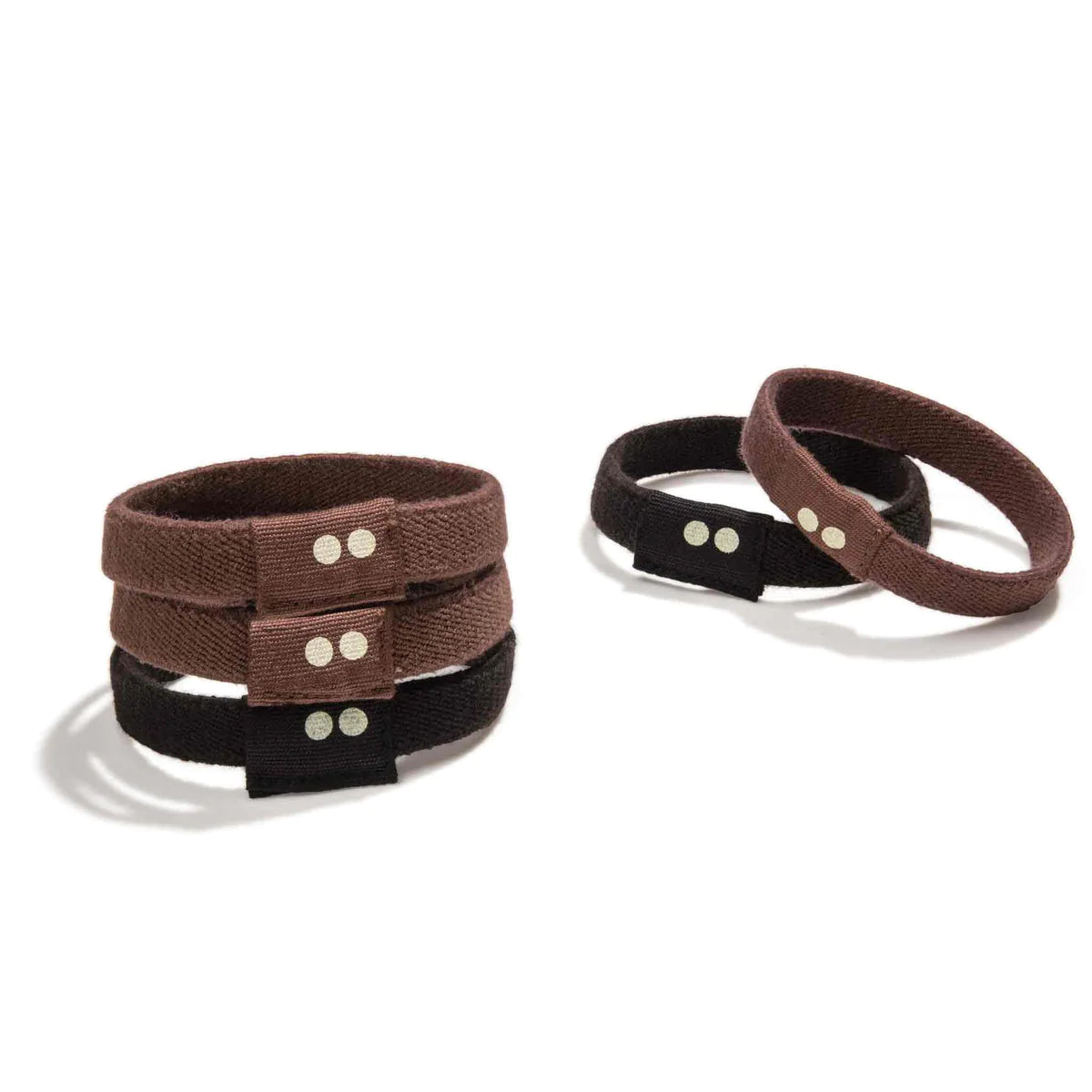 Plastic free hair ties in brown and black stacked