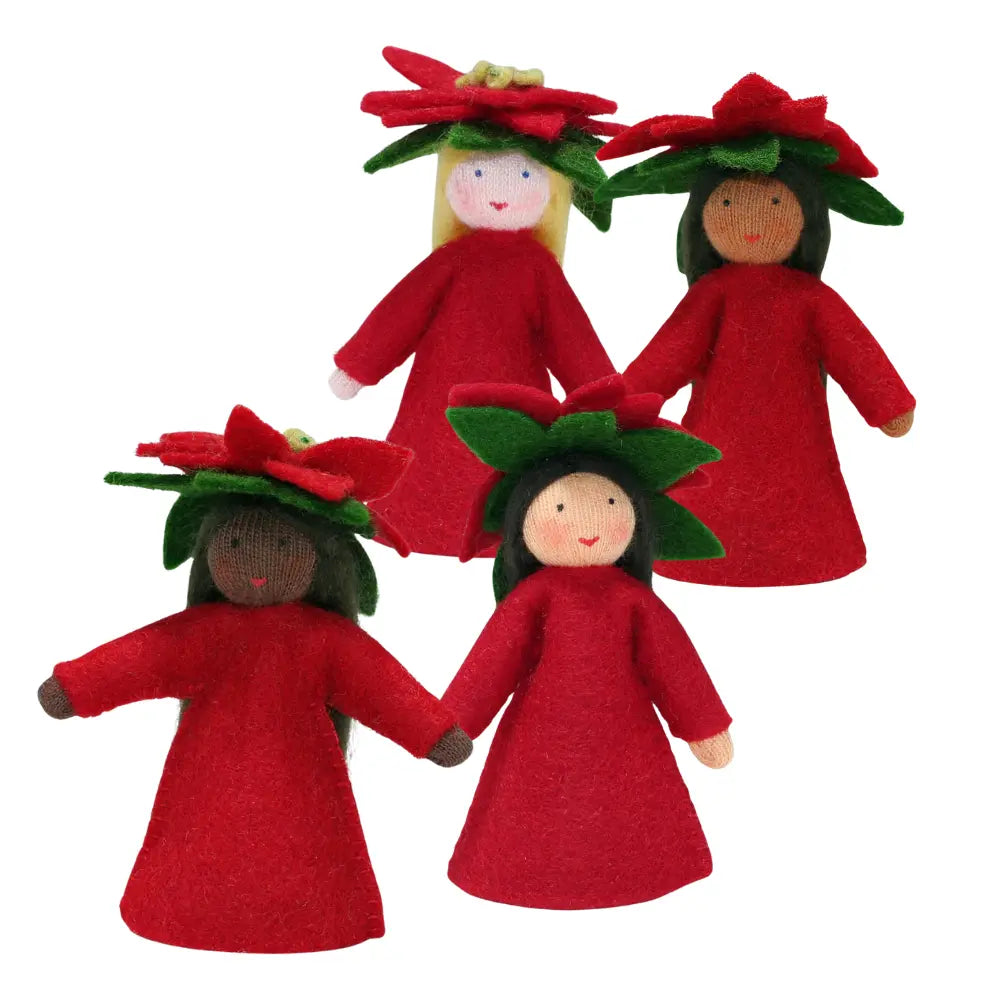 Four dolls in red dresses with floral poinsettia headbands on a white background