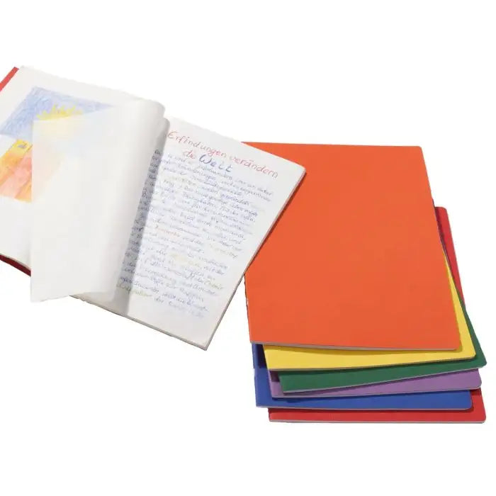 Colorful portrait style main lesson notebooks with one open on a white background