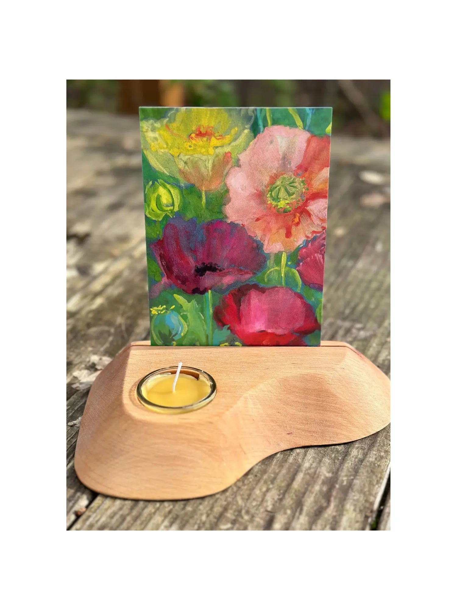 Alderwood Photo and Postcard Holder with Tealight and a postcard of poppies on rustic outdoor wooden table