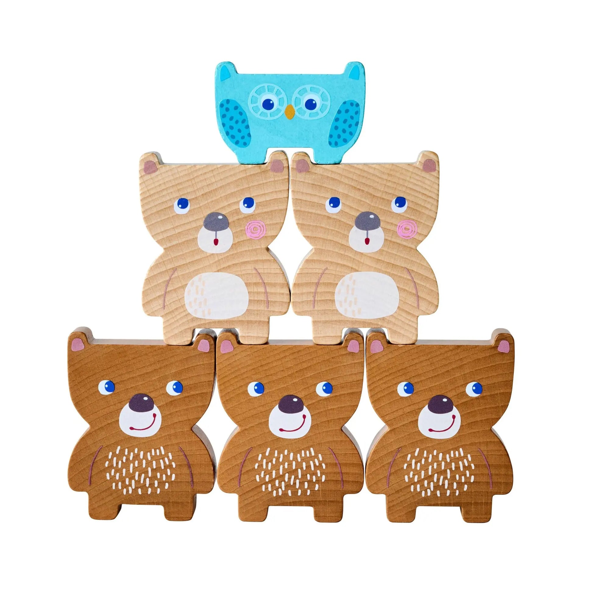 Set of wooden bear and owl toys on a white background