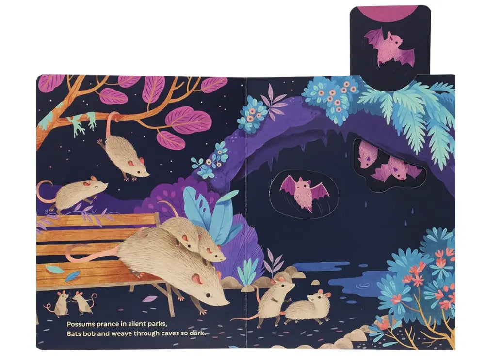 Illustrated children's book open to a page with possums and bats in a forest setting.