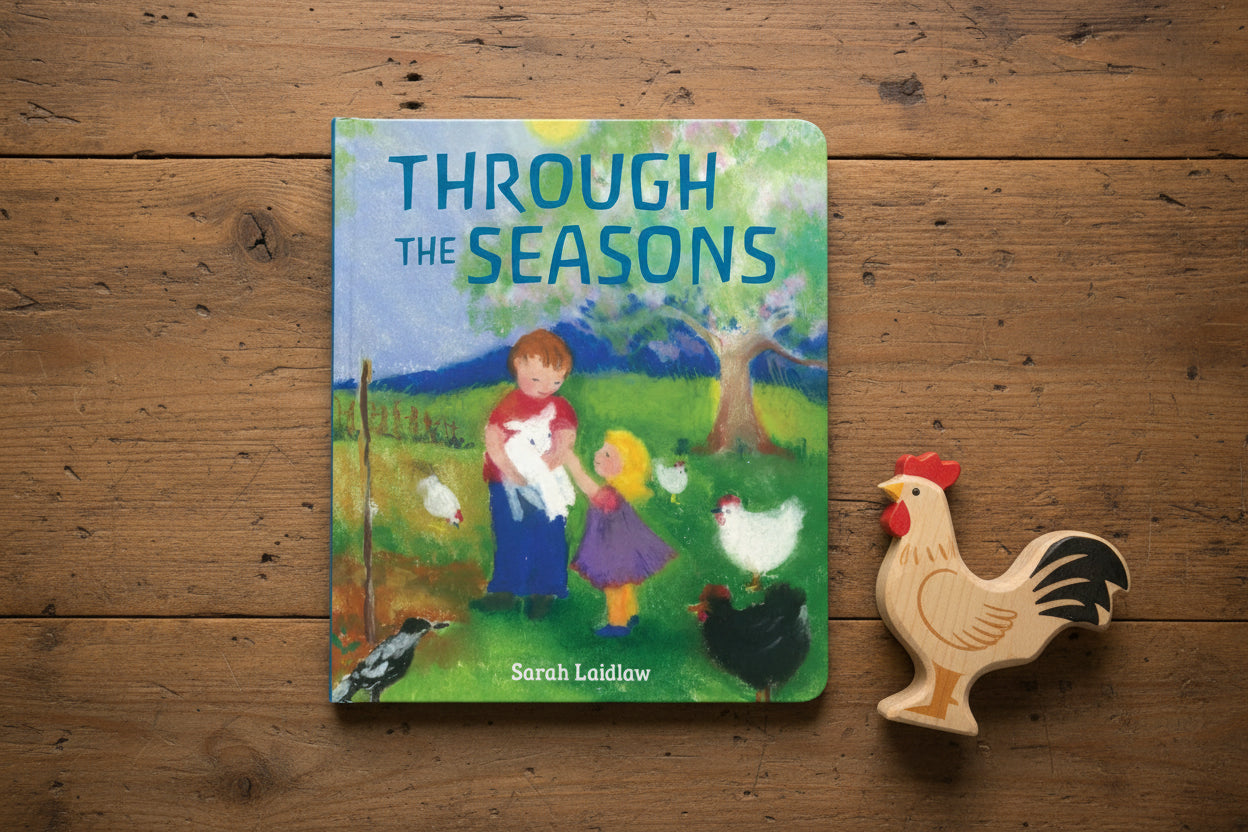 Book cover of 'Through the Seasons' by Sarah Laidlaw with children and animals in a pastoral scene.
