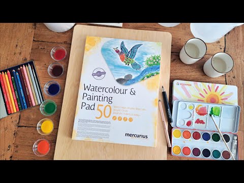 Art Makes Sense Watercolor Painting Pad on a Table and Painting Board with Stockmar Paints and Pencils