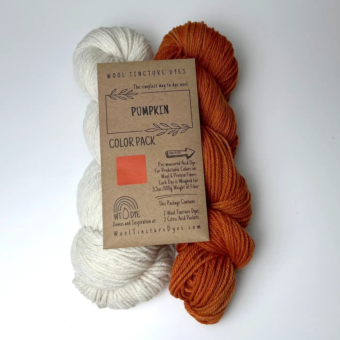 Pumpkin Wool Tincture tea bag dye color pack with undyed yarn and warm orange sample color.