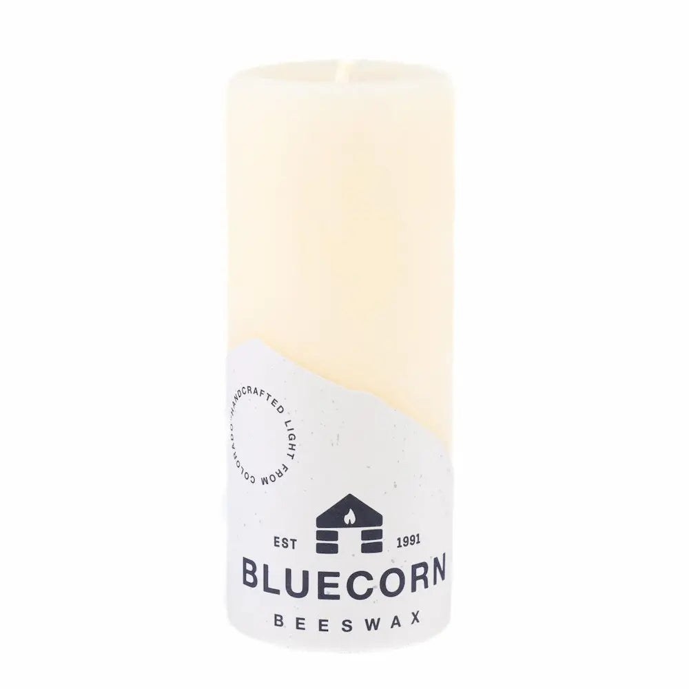 Beeswax candle with Bluecorn Beeswax branding on a white background
