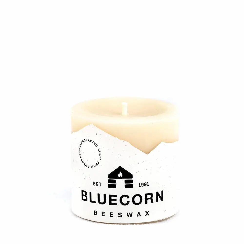 Candle in a white container with Bluecorn Beeswax logo on a white background
