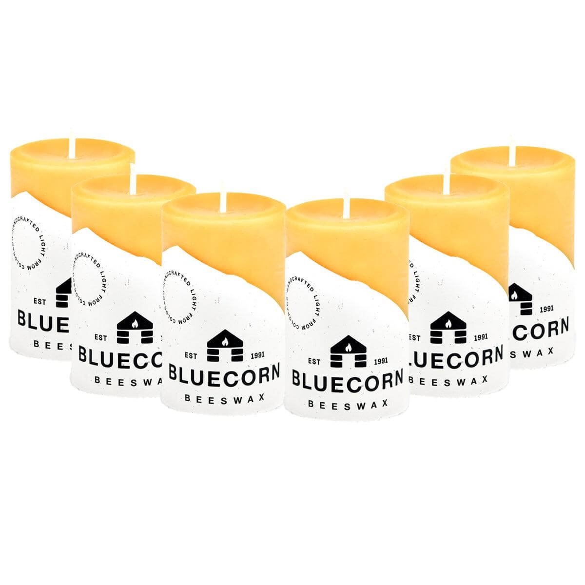 Set of six Bluecorn Beeswax candles on a white background