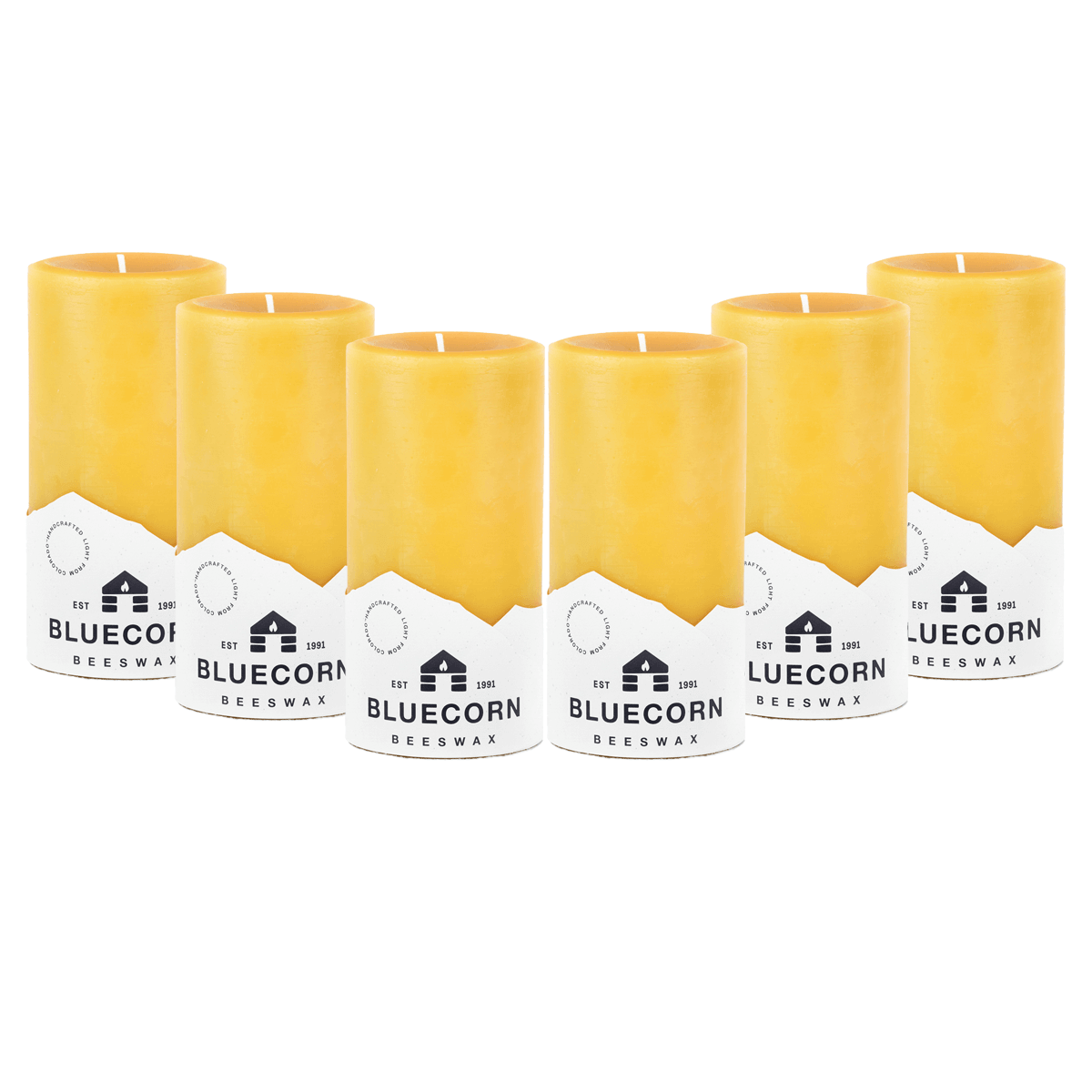 Set of six yellow candles with white labels on a white background
