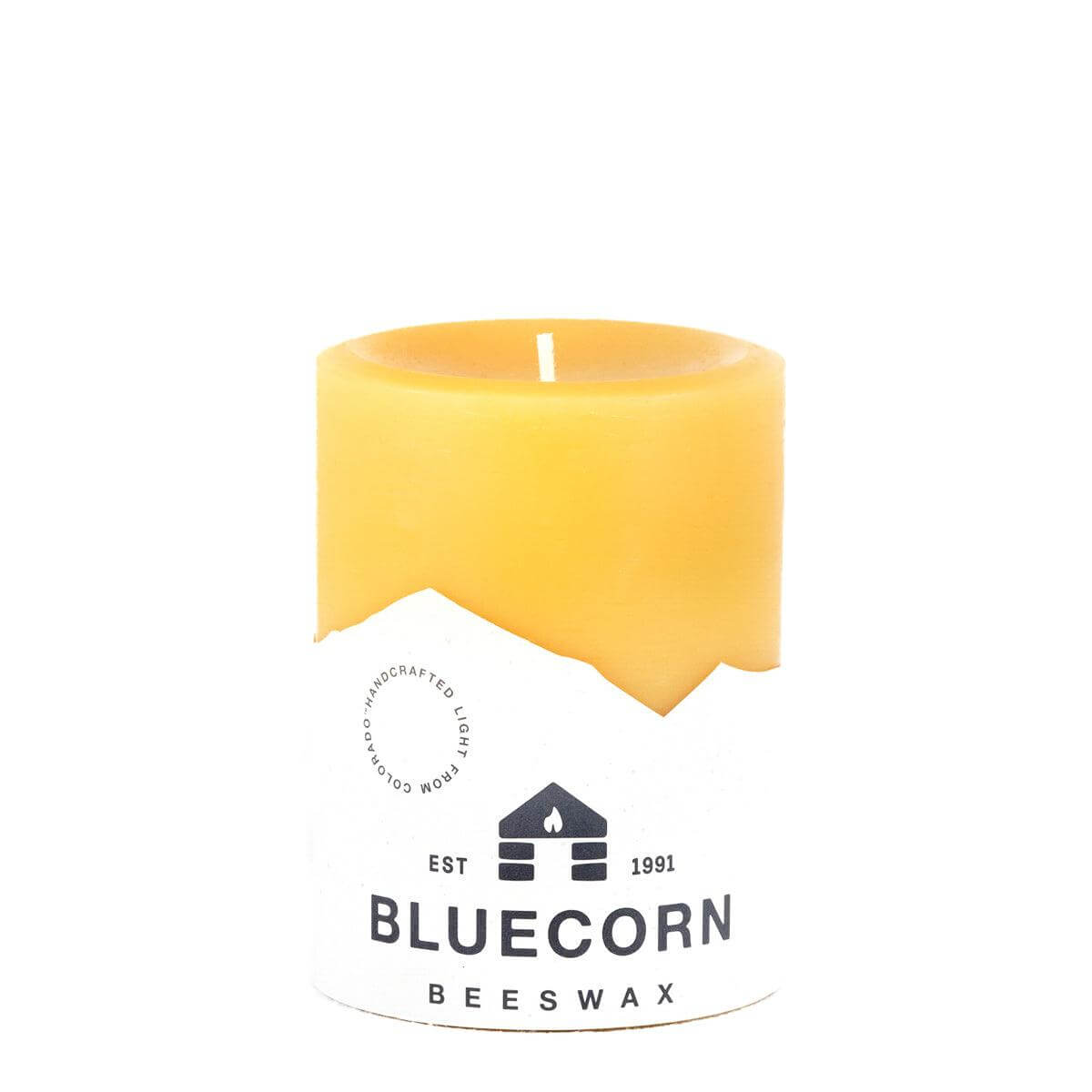 Yellow beeswax candle with Bluecorn Beeswax logo on a white background