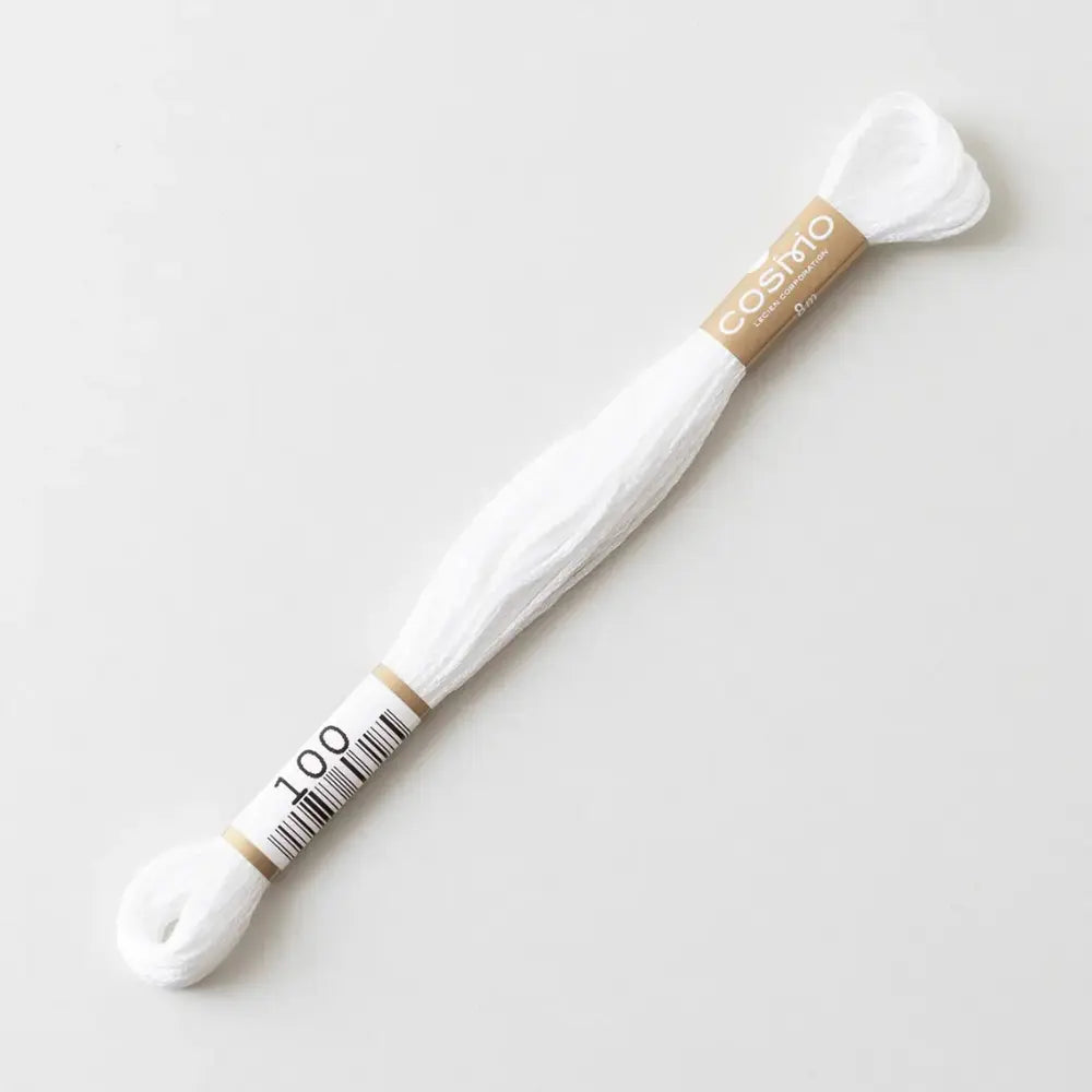 White cotton embroidery floss and 'Cosmo' branding on a light gray background
