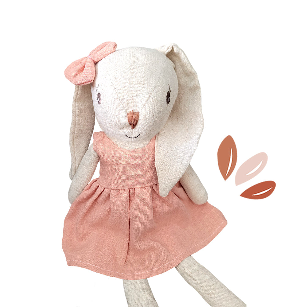 Soft rabbit doll wearing pink dress for nurturing pretend play and early childhood role play