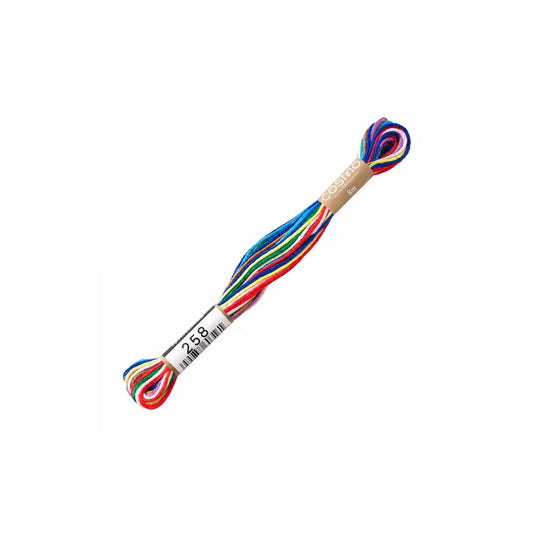 Colorful rainbow cotton embroidery floss on a white background