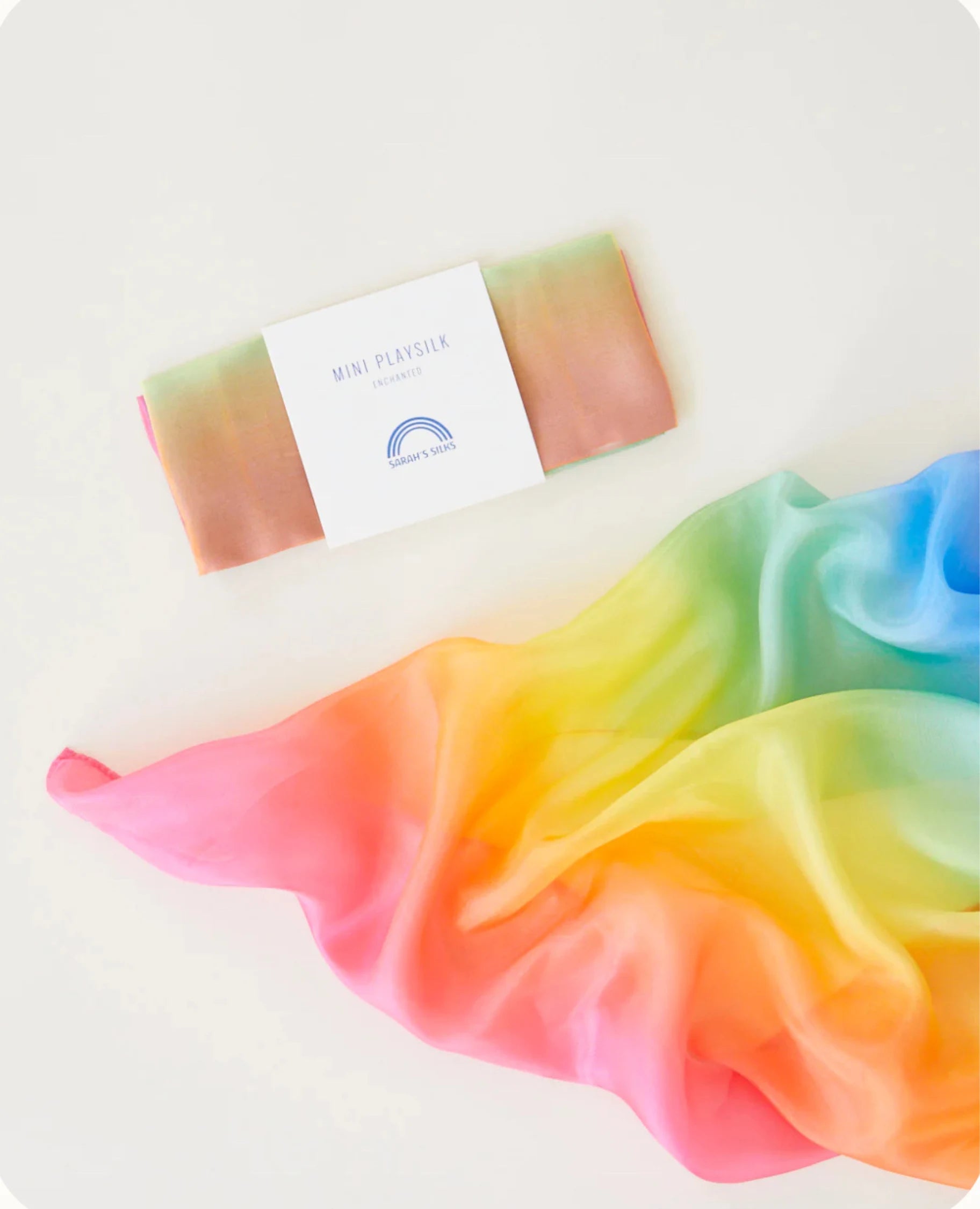 Rainbow enchanted playsilk on a light background