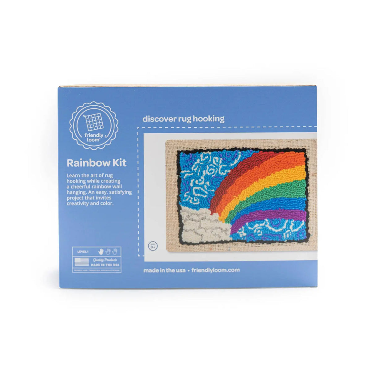 Front of the Friendly Loom Rainbow Kit box with a finished hooked rainbow picture, made in the USA