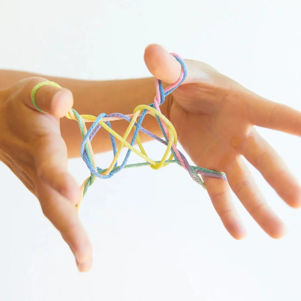 Ladder string figure made with rainbow string and held between two hands