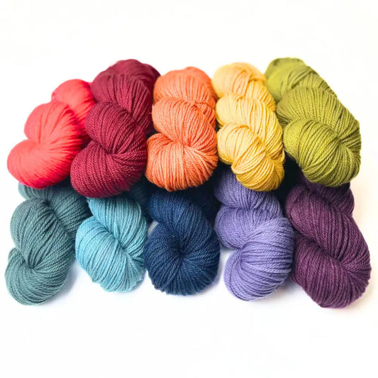 Rainbow sample of wool yarn dyed with Wool Tincture tea bag dyes for protein fibers.