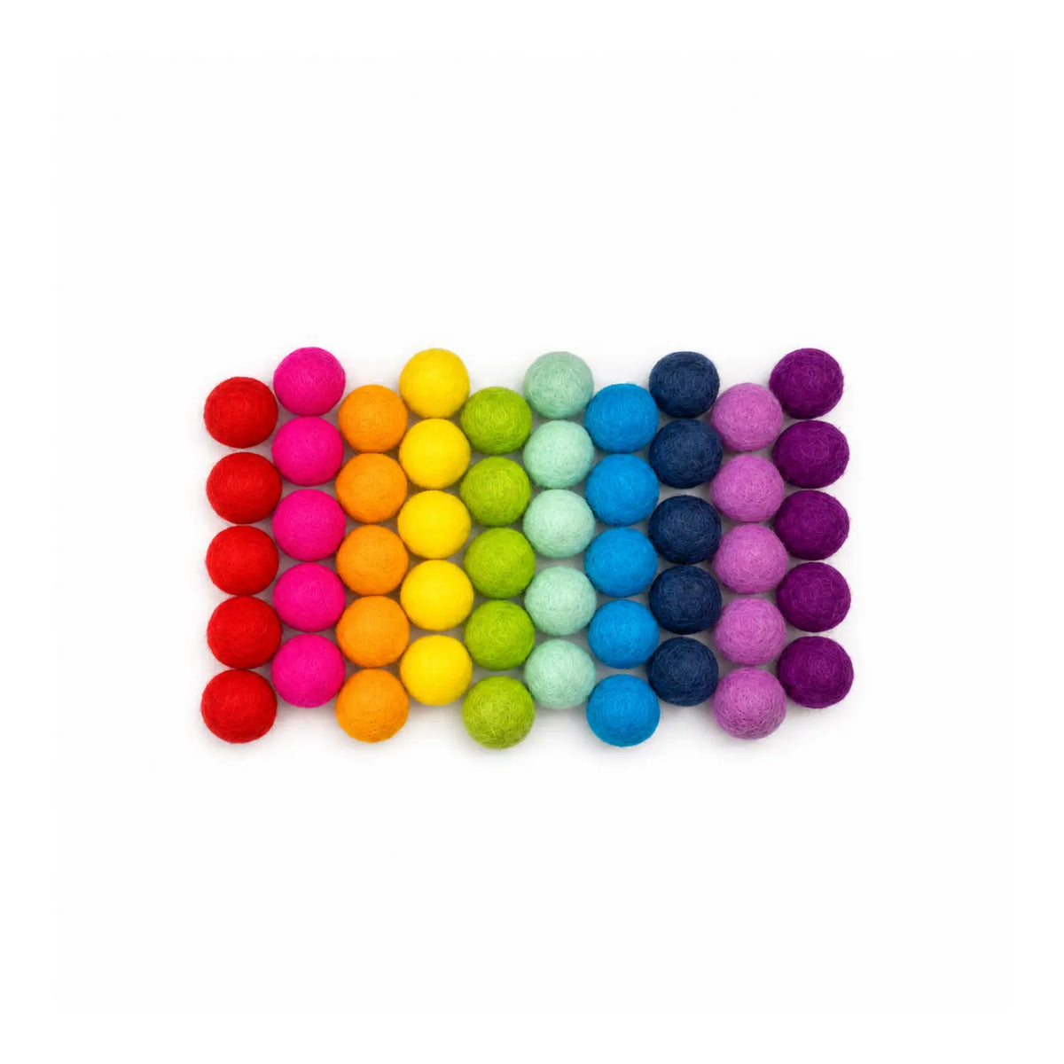 Handmade wool felt balls grouped by color on a white background.