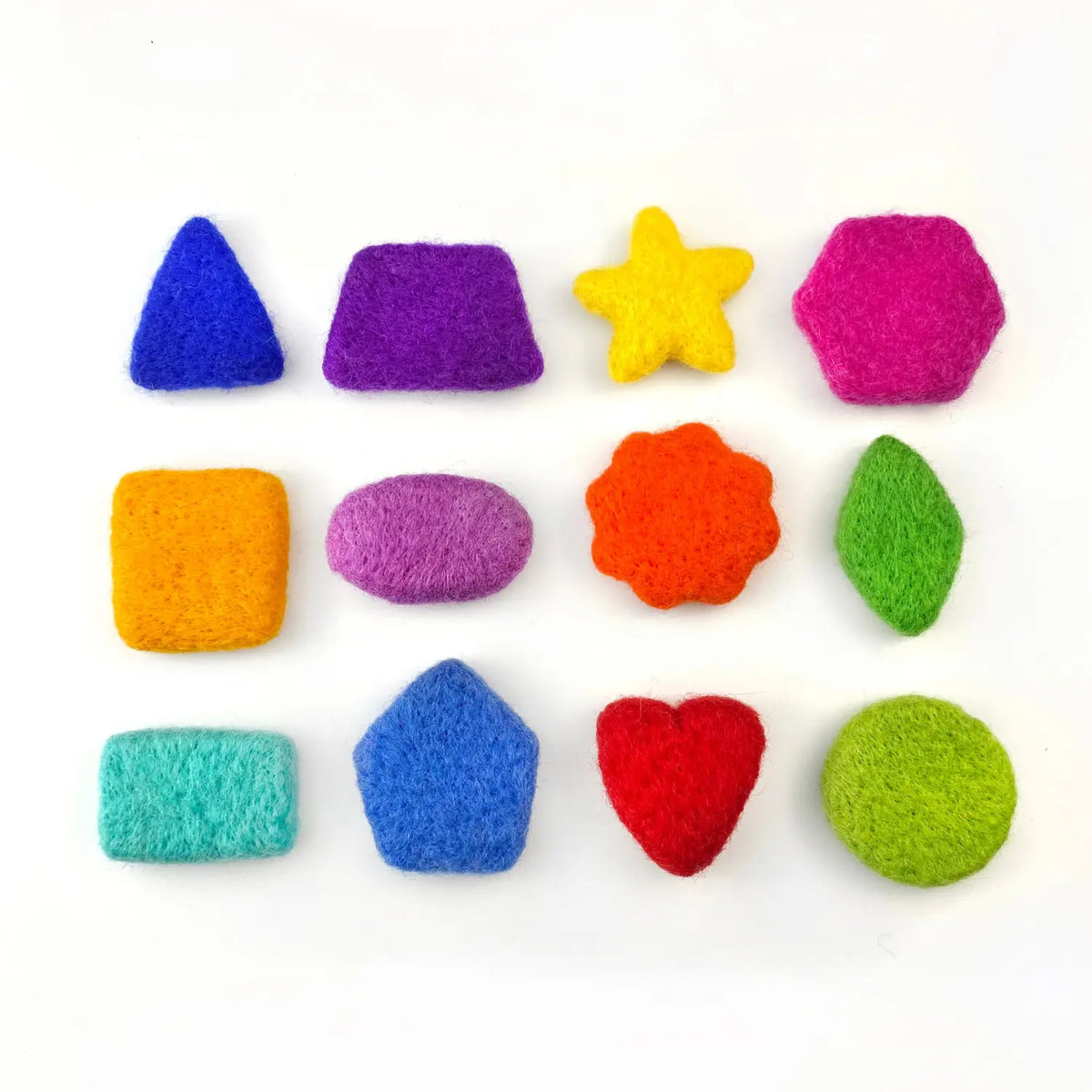 Twelve rainbow wool felt sorting shapes laid out in a grid, including a triangle, star, hexagon, flower, leaf, heart, and circle.