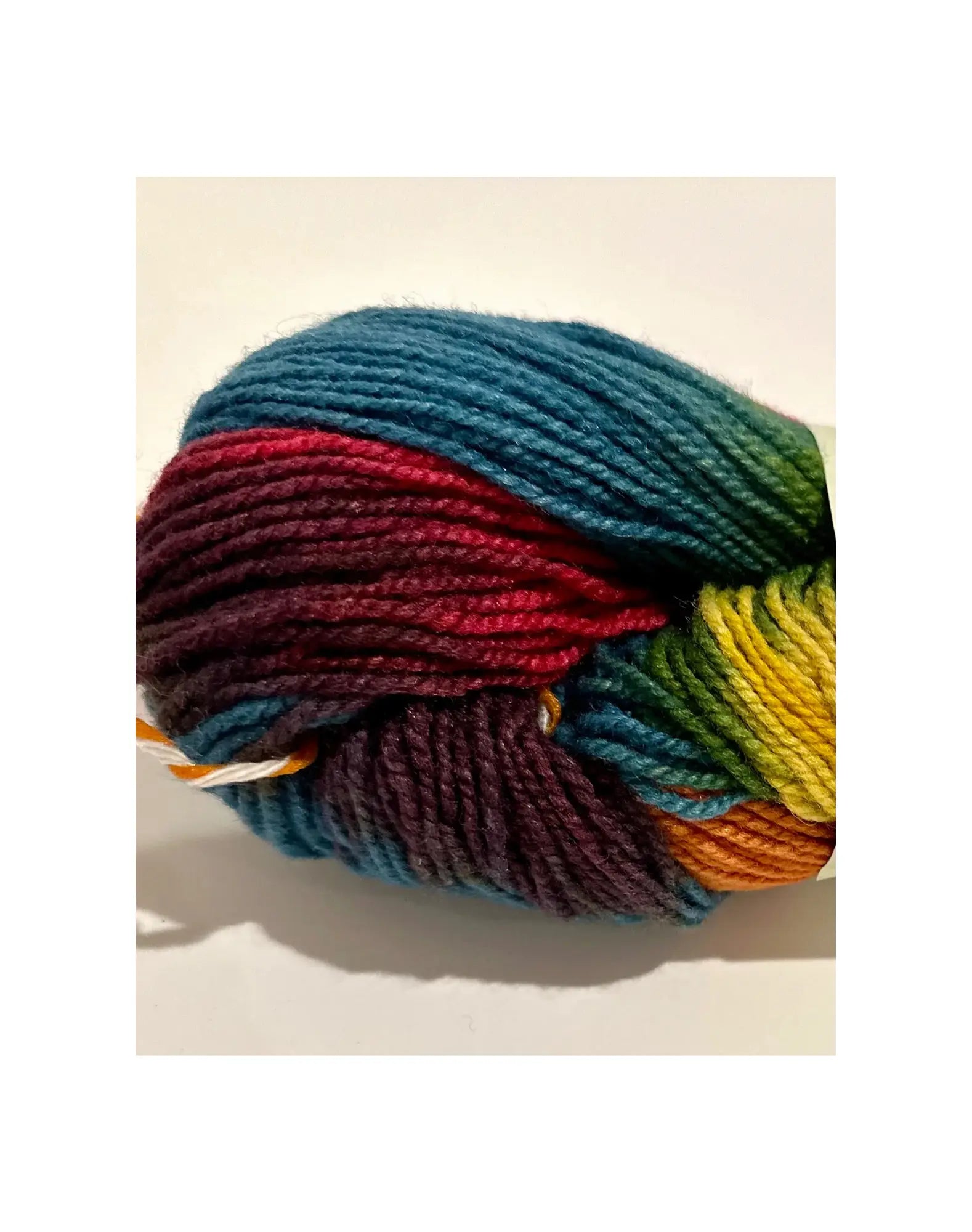 Organic Wool & Silk Plant Dyed Rainbow Yarn close up of blues, reds, purples, greens, yellow, oranges
