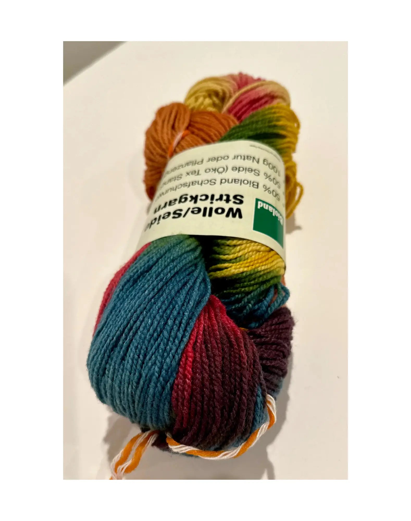 Organic Wool & Silk Plant Dyed Rainbow Yarnclose up of hank in bioland label