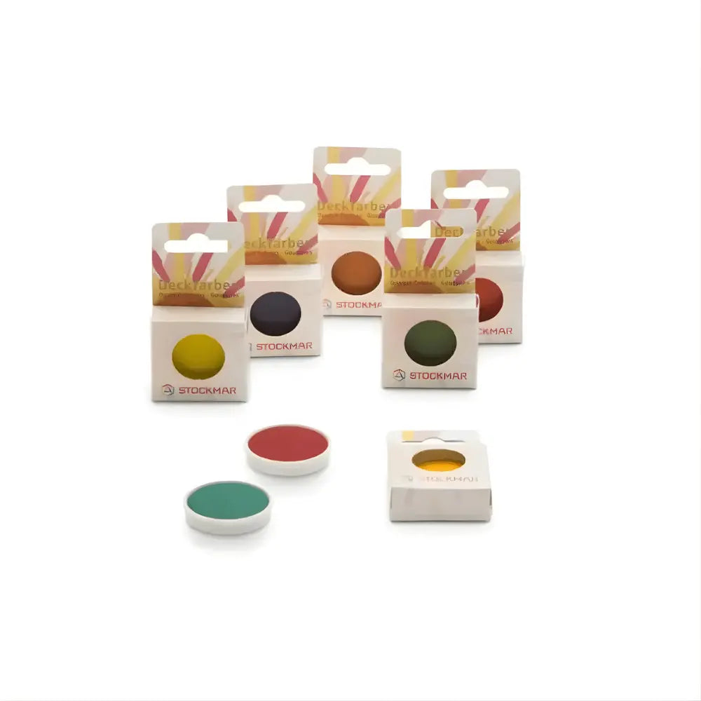 Colorful opaque watercolor refill containers with Stockmar brand on a white background