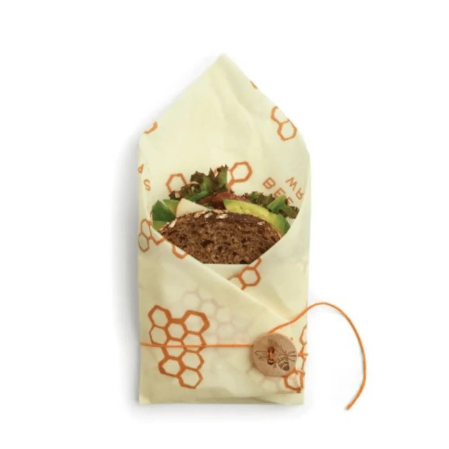 Beige reusable food wrap with honeycomb pattern and avocado slices on a white background