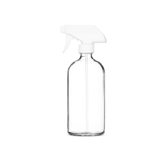 A clear glass empty reusable spray bottle with a white plastic trigger sprayer
