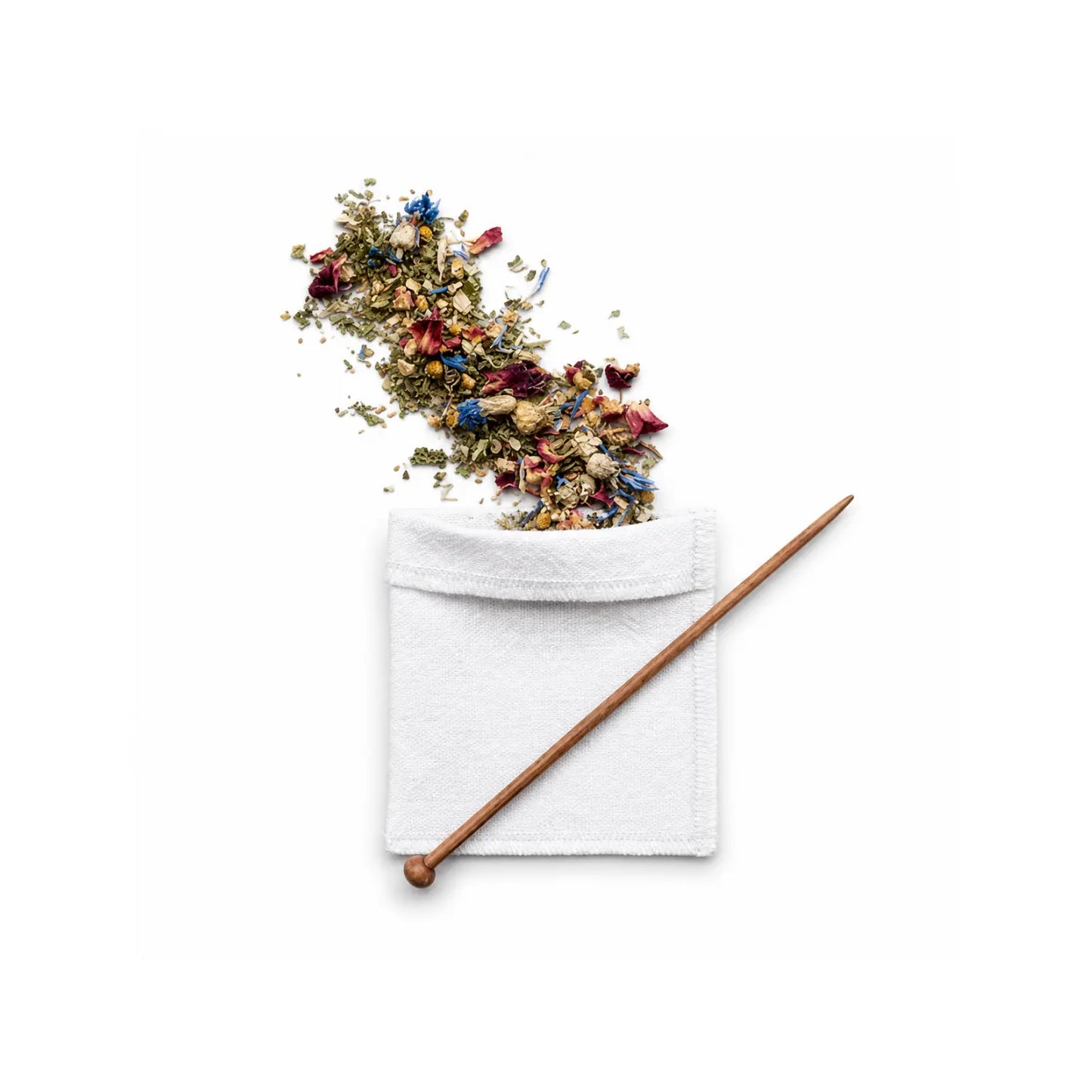 Reusable organic cotton tea bag with wooden balancing stick and loose herbal tea blend