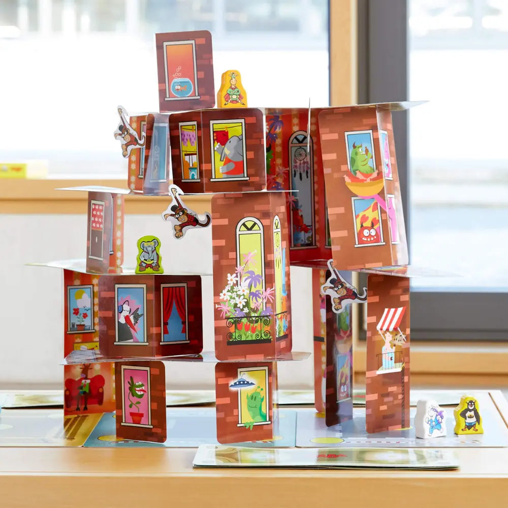 Rhino Hero Super Battle stacking card game on a table with pieces