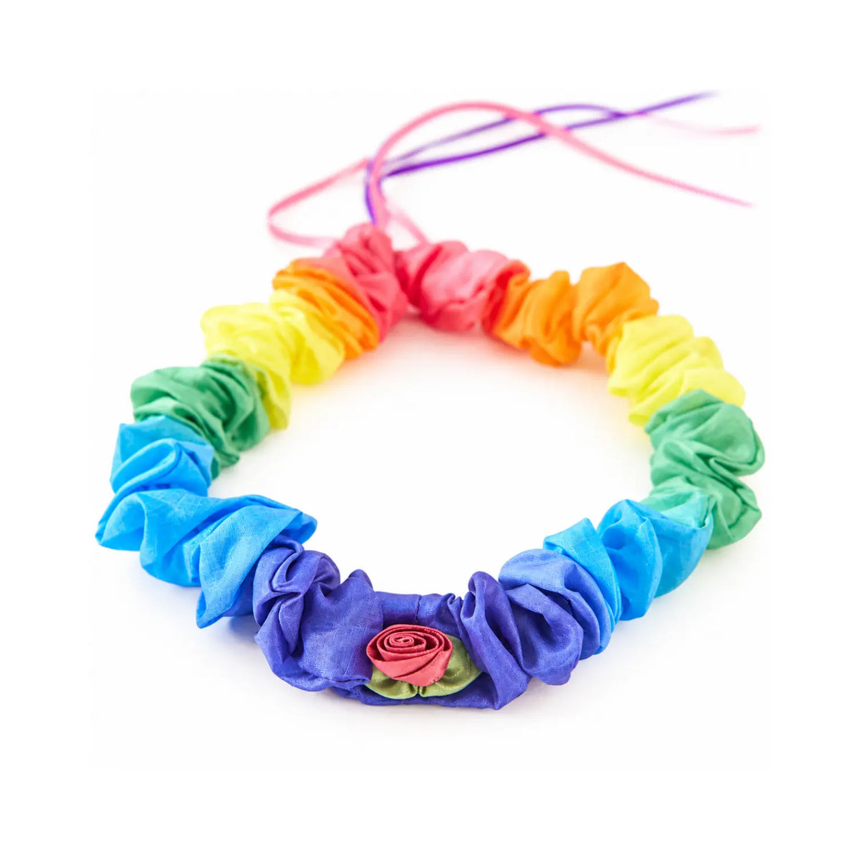 Close-up of the Rosette Rainbow silk garland showing the pink satin rosette and gathered rainbow silk