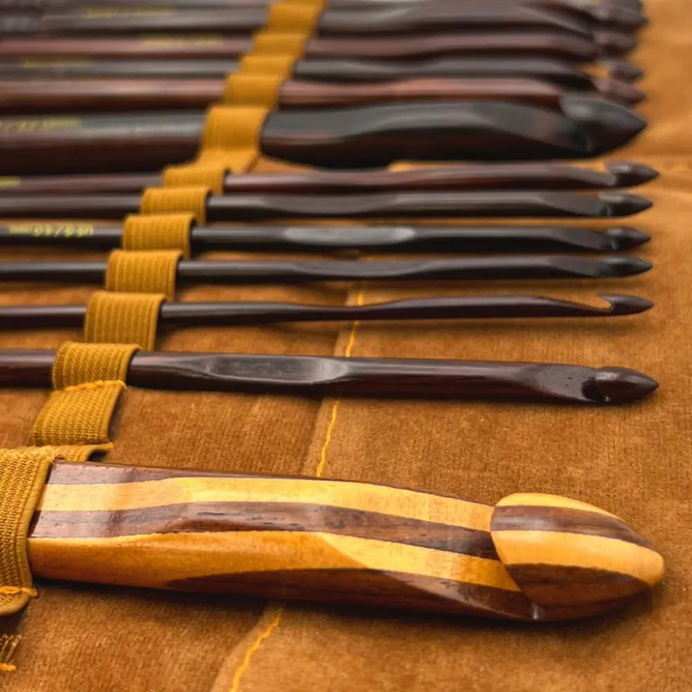 Set of chisels with wooden handles on a brown surface