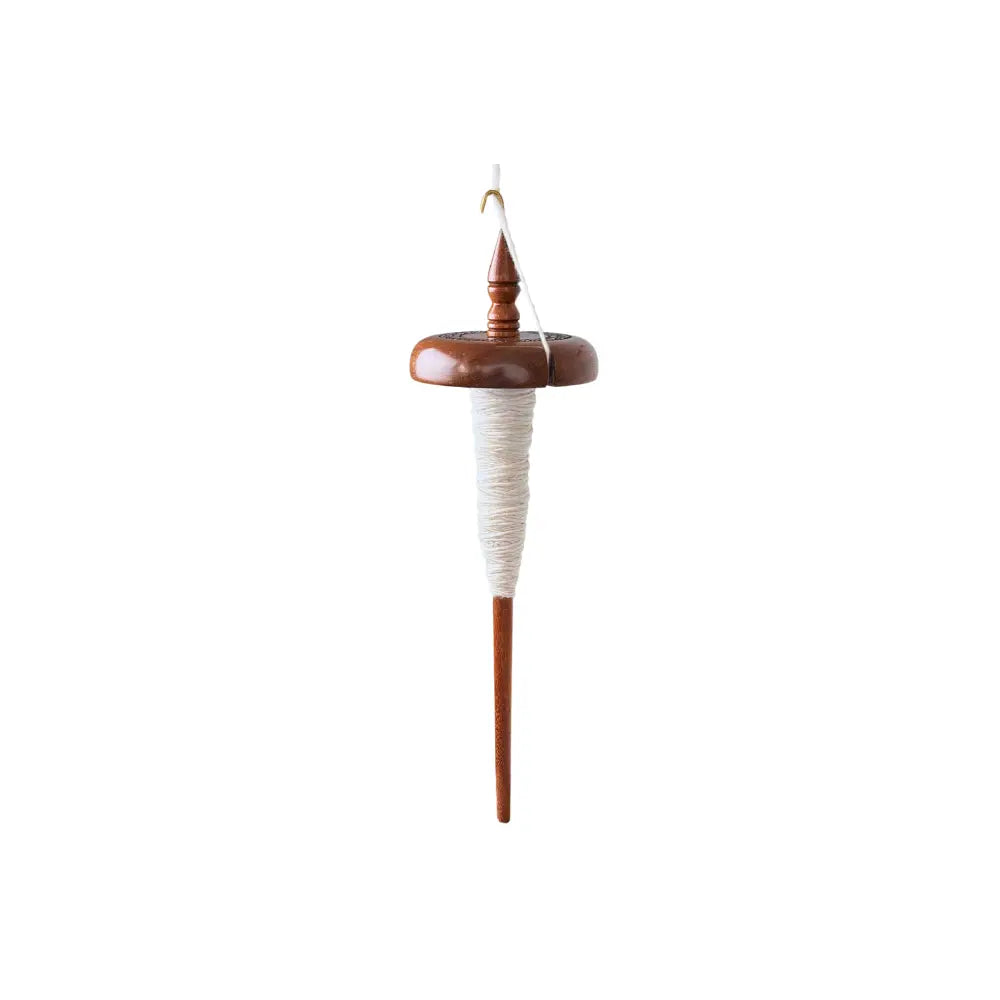 Wooden top whorl drop spindle with white yarn on a white background