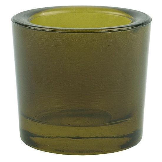 Green glass candle holder on a white background