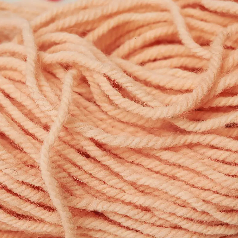 Organic plant-dyed Wool Yarn in salmon close up