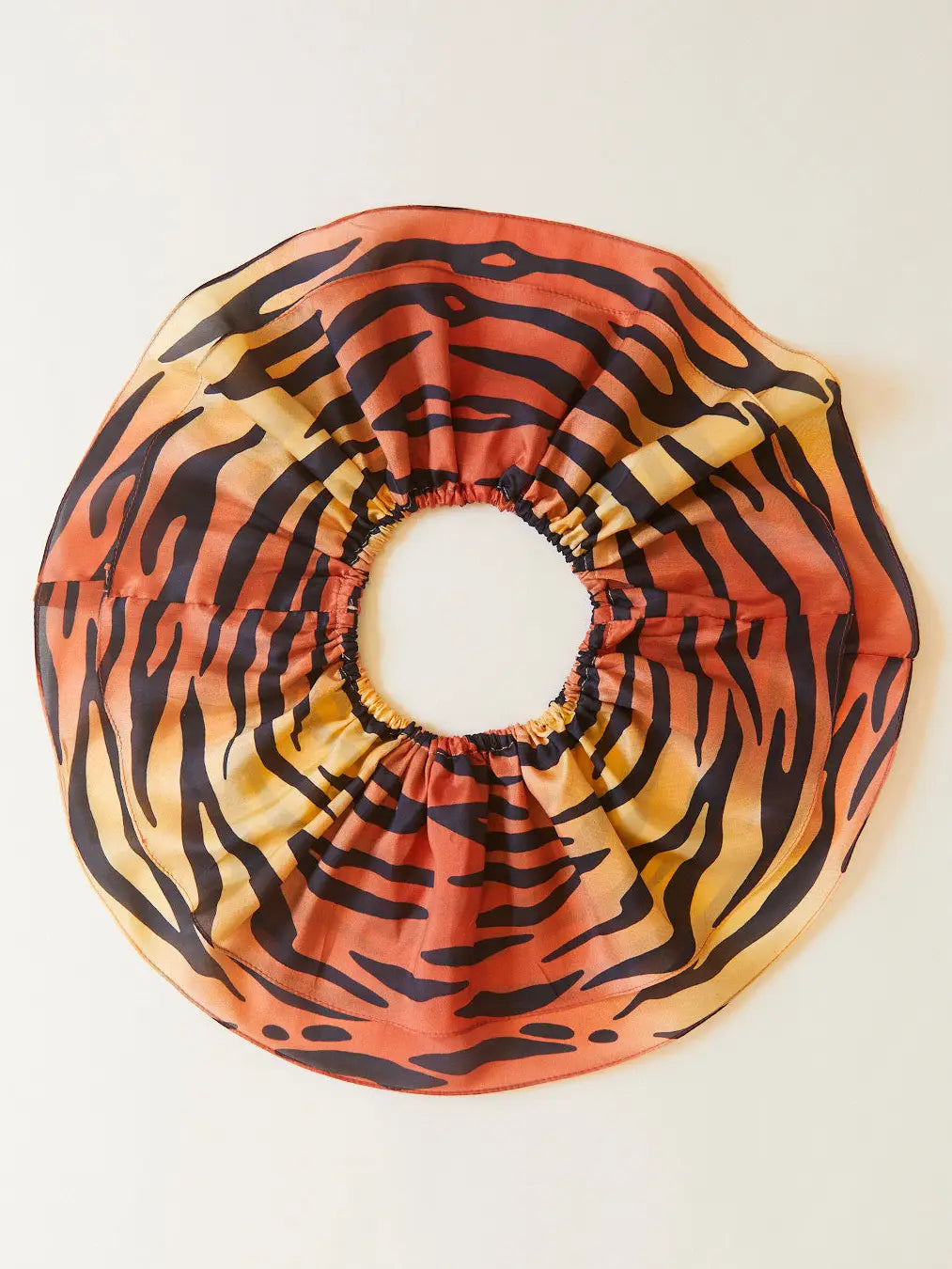 A ruffled Sarah's Silks tiger tutu made from silk from the top down view showing the animal print