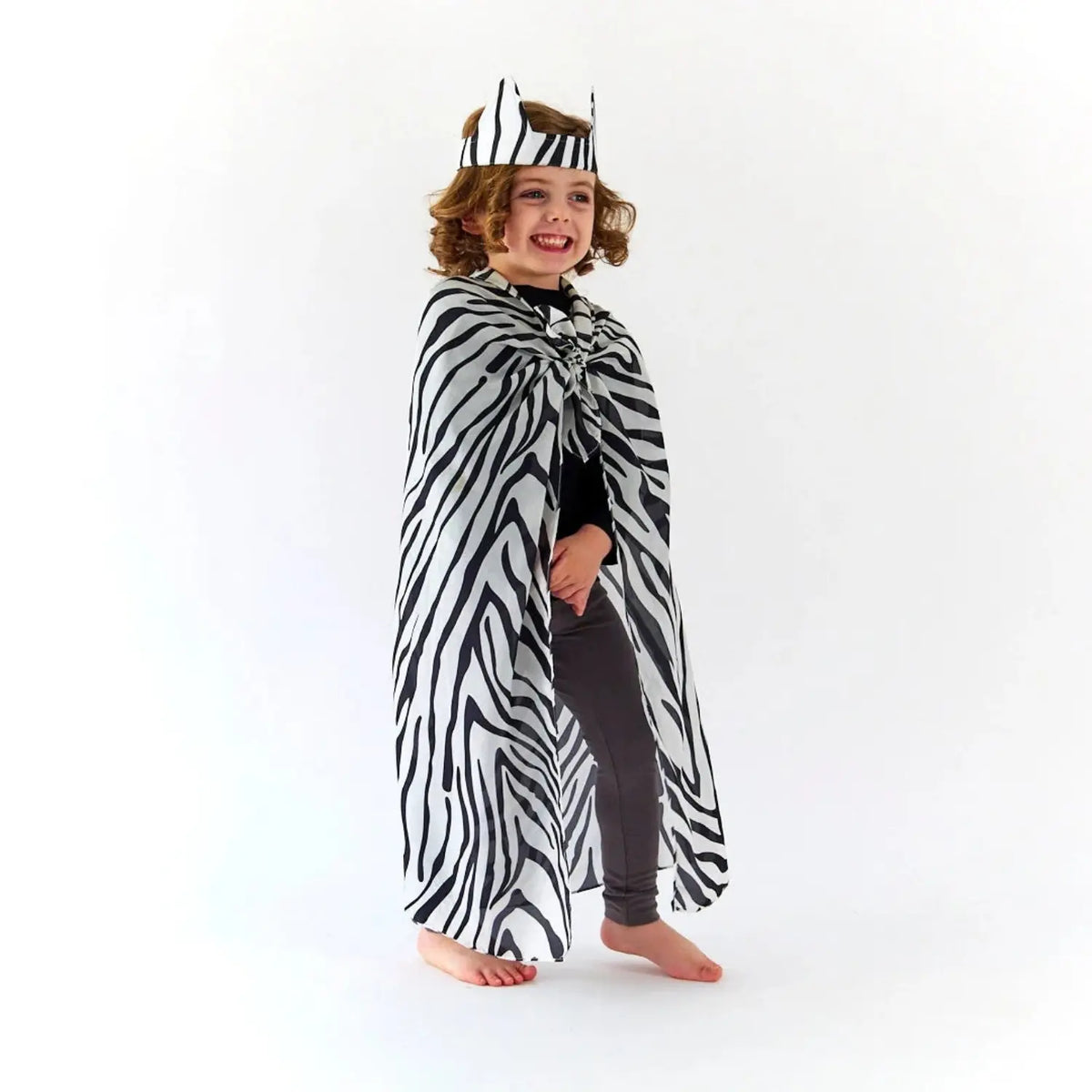 Child wearing Sarah’s Silks Zebra Ears with a zebra Playsilk for animal dress-up and imaginative play